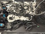 a table with a bunch of wires and cords on it