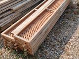 several pieces of wood are stacked on top of each other in a pile