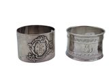 pair of silverplated napkin holders with a crest design