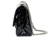 a close up of a black purse on a white background