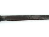 a picture of a knife that is on a white surface