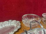 a table that has a bunch of glass dishes on it