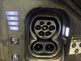 a close up of a car ' s plugged in to a vehicle