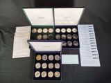 two boxes of silver coins are sitting on a table