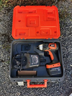 an orange tool kit sitting on top of a black and orange case