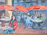 a painting of a woman sitting at a table with red umbrellas