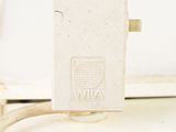 a small white device that is plugged into a wall