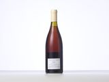 a bottle of wine that is sitting on a table