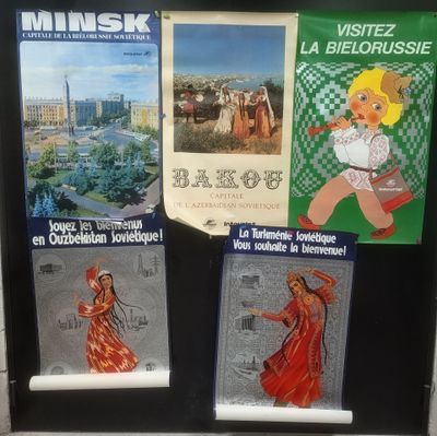 three posters on the door of a building with pictures on them