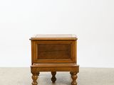 a small wooden table with a drawer on top of it