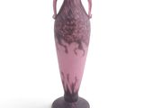 a purple vase that has a handle on it