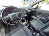the interior of a car with a steering wheel and dashboard