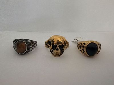 three rings and a ring with a skull on it