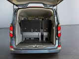 a small van with luggage in the back of it
