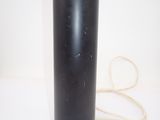 an image of a black vase on a white surface