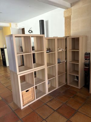 a room that has a bunch of shelves in it