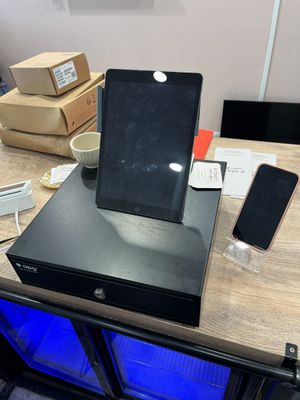 un matériel de caisse comprenant une tablette APPLE iPad mod…