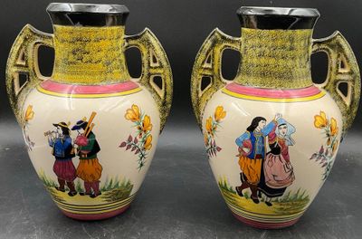 two vases that have been painted with people on them