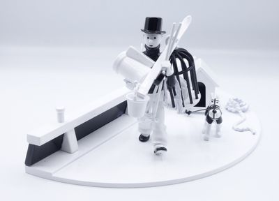 a toy figure of a man with a sword and a dog