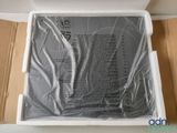 an open box of a laptop computer sitting on top of a cardboard box