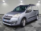 the silver van is parked in a room with a checkered floor
