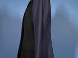 an image of a suit on a mannequin stand against a blue background