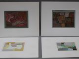 three framed pictures of a couple of paintings on a wall