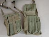 pair of military style pouchs on a white surface