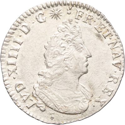 une pièce d'argent portant l'image d'un homme