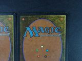 two decks of magic the gathering are shown on a table