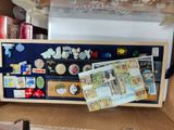 a cardboard box with magnets and other items in it