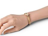 gold plated bracelet with a diamond accent and a leather band