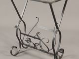 a small table with a glass top and metal legs