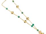 a gold and green beaded necklace with green beads