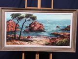 une photo d'un tableau posé sur un chevalet au bord de l'eau