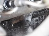 a close up of a metal object with a screw on it