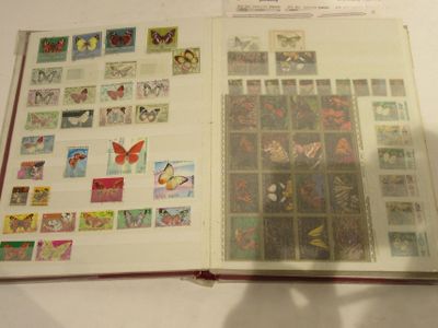 an open book with stamps on it sitting on a table