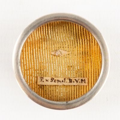 an image of a close up of a ring on a white surface