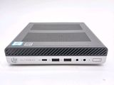the back view of a laptop computer sitting on top of a white surface