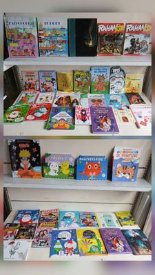 many children ' s books on the shelves in the store