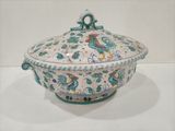 a large bowl with a lid that has a rooster design on it