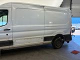 a white van that is parked in a garage
