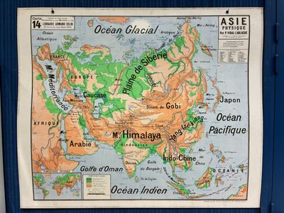 a map of asia on the wall of a bus stop