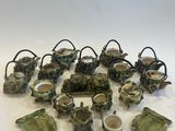 a lot of small pieces of pottery on the table