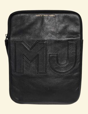 a black leather bag with the m u logo on it