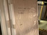 a mattress that is in the middle of a room