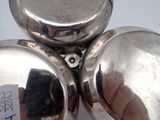 a close up of a silver object with a tag on it