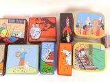 a lot of tins that are sitting on a table