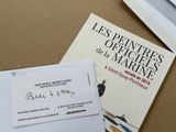 two books and a pair of scissors sitting on a table