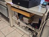 a kitchen with a counter with a printer on top of it